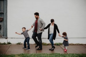 family-of-four-walking-at-the-street-2253879 3